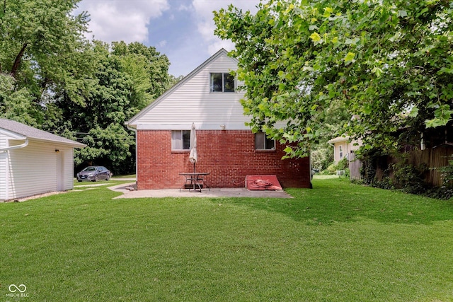 47 Habig Rd, Indianapolis, IN 46217 - back of house with brick siding, a yard, and a patio area