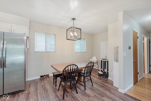 47 Habig Rd, Indianapolis, IN 46217 - dining area featuring wood finished floors and a chandelier