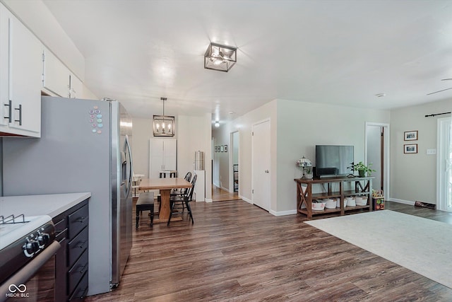 47 Habig Rd, Indianapolis, IN 46217 - kitchen with range, dark wood-style floors, a chandelier, light countertops, and white cabinetry