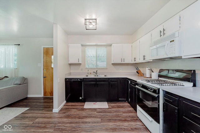 47 Habig Rd, Indianapolis, IN 46217 - kitchen with white appliances, dark cabinetry, and light countertops