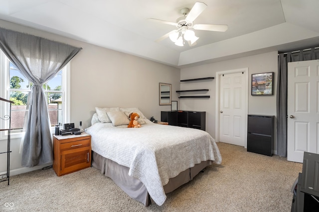 2847 Macintosh, Columbus, IN 47201 - bedroom featuring light carpet, a tray ceiling, and ceiling fan