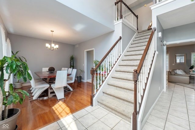 2847 Macintosh, Columbus, IN 47201 - staircase featuring a chandelier and tile patterned flooring