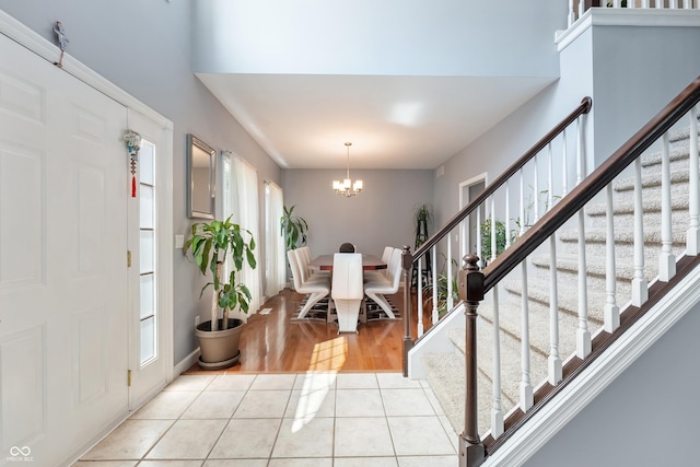 2847 Macintosh, Columbus, IN 47201 - foyer with a chandelier, stairs, and light tile patterned floors