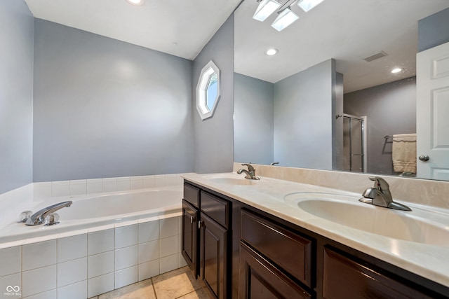 2847 Macintosh, Columbus, IN 47201 - full bathroom featuring a bath, double vanity, a stall shower, tile patterned floors, and recessed lighting