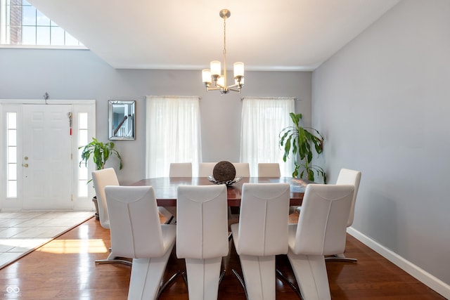 2847 Macintosh, Columbus, IN 47201 - dining space with a chandelier, plenty of natural light, and wood finished floors