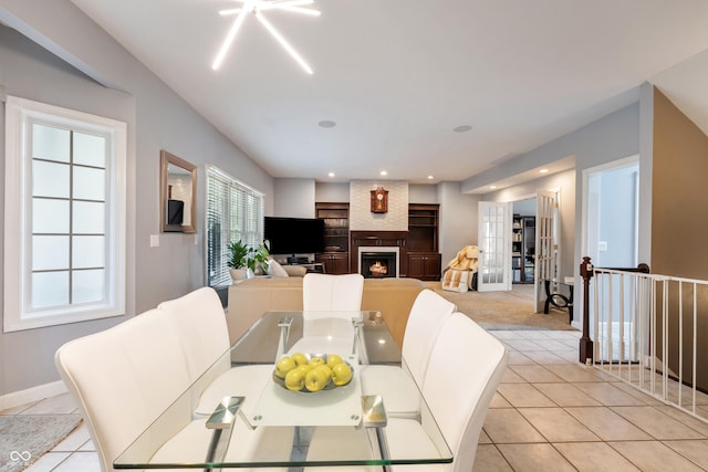 2847 Macintosh, Columbus, IN 47201 - dining area featuring light tile patterned floors and a fireplace