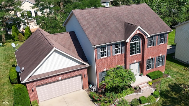 2847 Macintosh, Columbus, IN 47201 - colonial home with driveway, a garage, brick siding, and a shingled roof