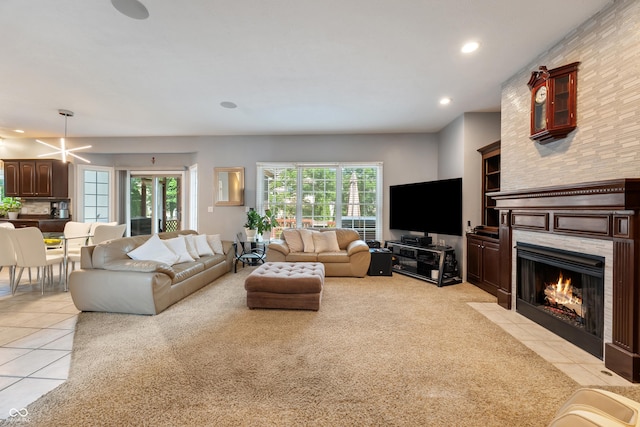 2847 Macintosh, Columbus, IN 47201 - living area with light tile patterned floors, recessed lighting, a fireplace, and light colored carpet