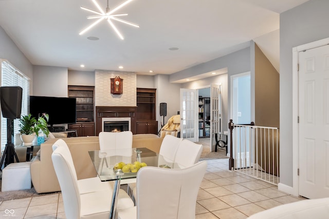 2847 Macintosh, Columbus, IN 47201 - dining area featuring light tile patterned flooring, a large fireplace, and recessed lighting