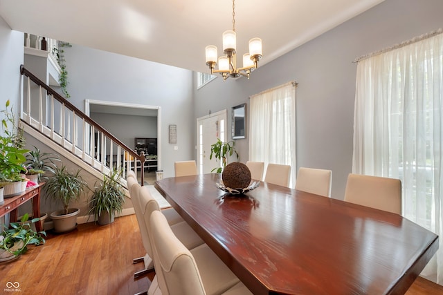 2847 Macintosh, Columbus, IN 47201 - dining space with stairway, a chandelier, and light wood finished floors