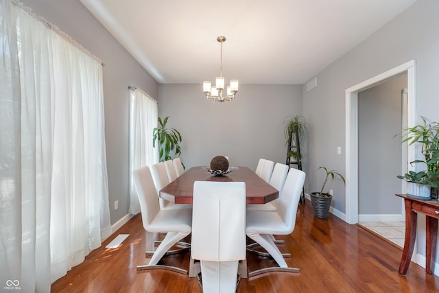 2847 Macintosh, Columbus, IN 47201 - dining space featuring a chandelier and wood finished floors