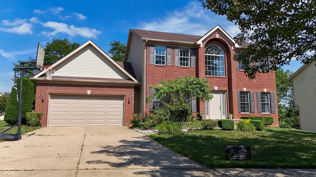 2847 Macintosh, Columbus, IN 47201 - view of front of house with brick siding, concrete driveway, a front lawn, and an attached garage