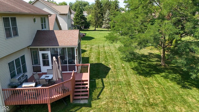 2847 Macintosh, Columbus, IN 47201 - view of grassy yard featuring a deck and a sunroom