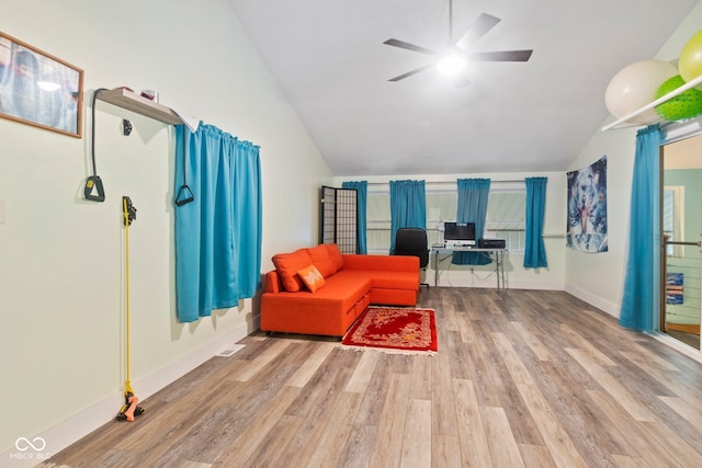 7437 Center Lake Rd, Nineveh, IN 46164 - living area with vaulted ceiling, wood finished floors, and a ceiling fan