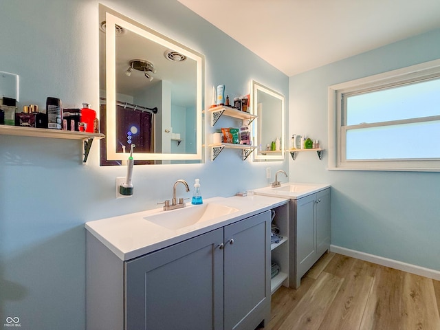 8883 W Hilltop Ln, Elwood, IN 46036 - full bath featuring double vanity and wood finished floors