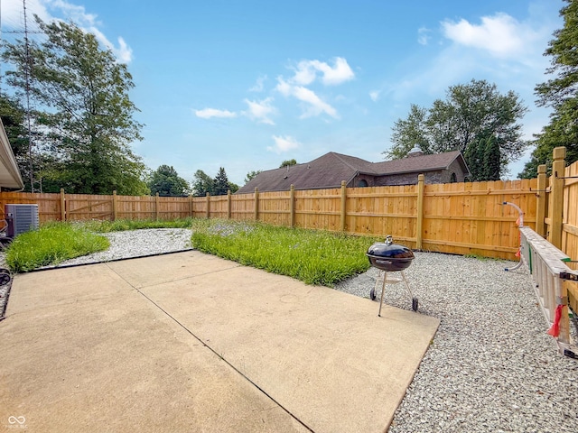 8883 W Hilltop Ln, Elwood, IN 46036 - fenced backyard with a patio area and area for grilling