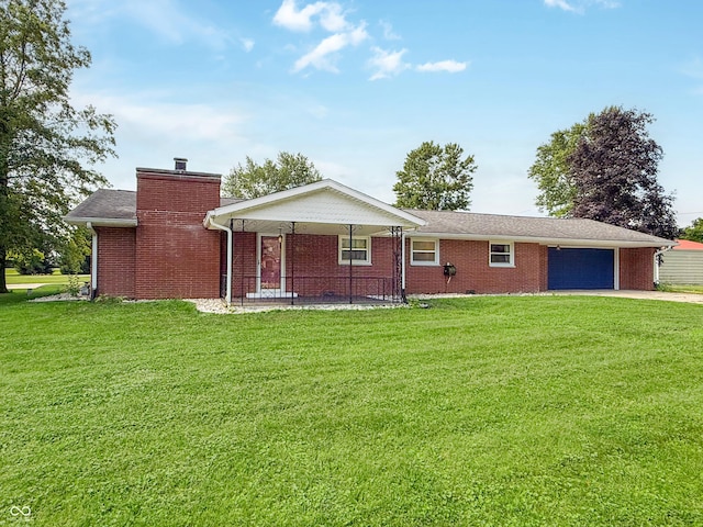 8883 W Hilltop Ln, Elwood, IN 46036 - view of front facade featuring a garage, a front lawn, concrete driveway, and a chimney