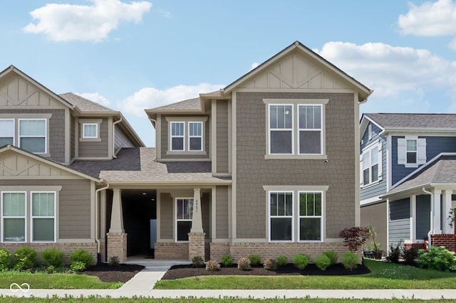 6951 Antiquity Dr, Carmel, IN 46033 - craftsman inspired home with board and batten siding, brick siding, a front lawn, and roof with shingles