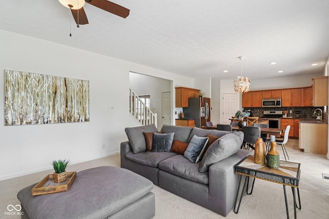 10792 Sawgrass Dr, Fishers, IN 46037 - living area featuring a chandelier, recessed lighting, stairs, and ceiling fan
