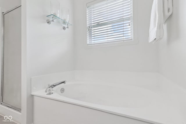 10792 Sawgrass Dr, Fishers, IN 46037 - full bathroom with a bath and a stall shower