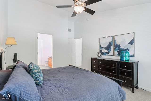 10792 Sawgrass Dr, Fishers, IN 46037 - carpeted bedroom with high vaulted ceiling, ensuite bath, and a ceiling fan