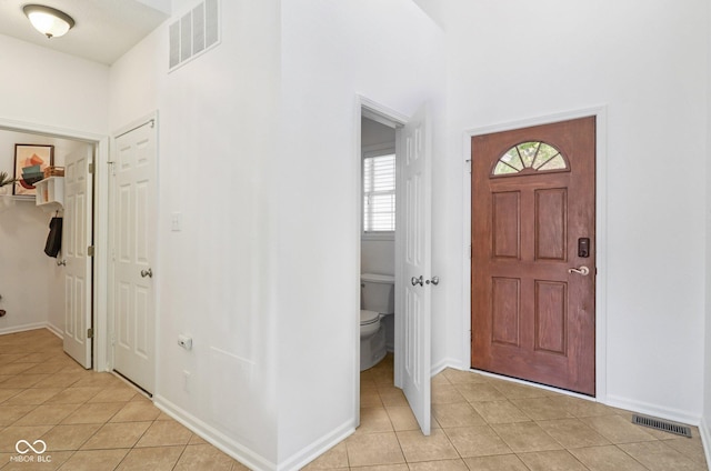 10792 Sawgrass Dr, Fishers, IN 46037 - entrance foyer featuring light tile patterned flooring and baseboards