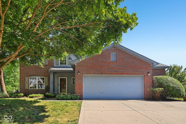 10792 Sawgrass Dr, Fishers, IN 46037 - traditional-style home with concrete driveway, an attached garage, a front lawn, and brick siding