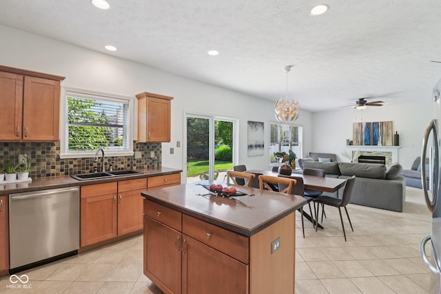 10792 Sawgrass Dr, Fishers, IN 46037 - kitchen featuring appliances with stainless steel finishes, dark countertops, light tile patterned floors, decorative backsplash, and recessed lighting