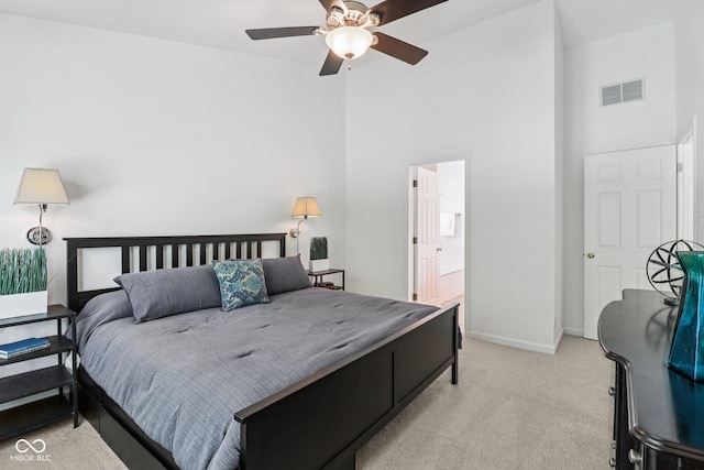 10792 Sawgrass Dr, Fishers, IN 46037 - bedroom with light colored carpet, a high ceiling, ensuite bath, and ceiling fan