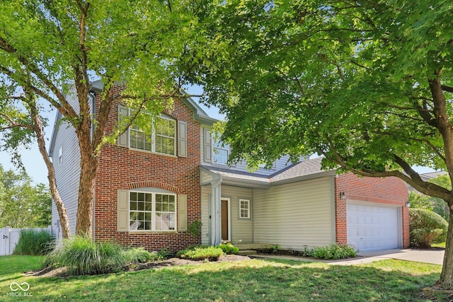10792 Sawgrass Dr, Fishers, IN 46037 - traditional home featuring a garage, brick siding, and driveway