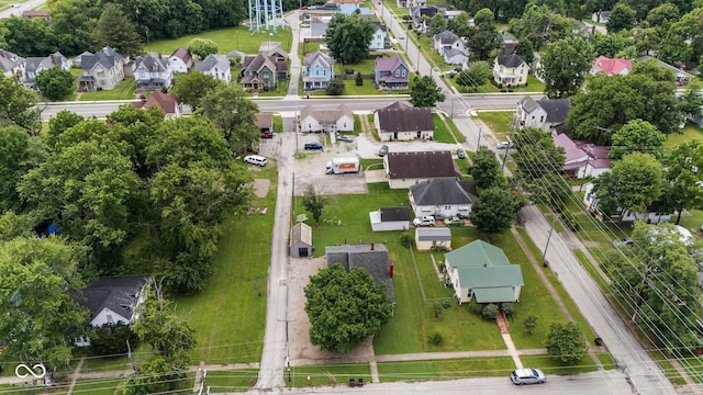43 W Main St, North Vernon, IN 47265 - aerial view of property's location with nearby suburban area and a tree filled landscape