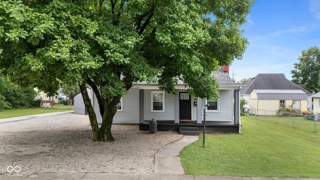 43 W Main St, North Vernon, IN 47265 - view of front of house with covered porch and a chimney