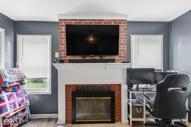 43 W Main St, North Vernon, IN 47265 - living room with a fireplace, wood finished floors, and a desk
