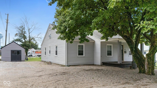 43 W Main St, North Vernon, IN 47265 - view of front facade with a porch and a storage shed