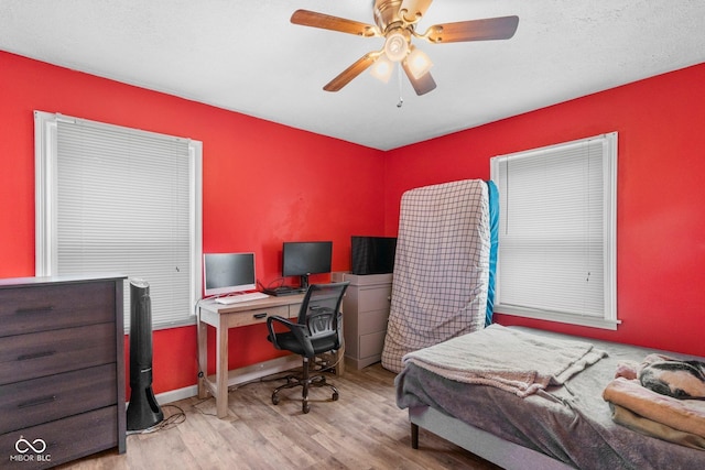43 W Main St, North Vernon, IN 47265 - bedroom featuring wood finished floors, an office area, and a ceiling fan