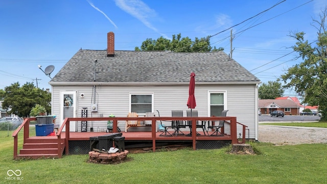 43 W Main St, North Vernon, IN 47265 - back of property with a shingled roof, a lawn, and a deck