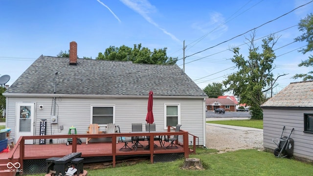 43 W Main St, North Vernon, IN 47265 - back of property with a shingled roof, a wooden deck, a yard, and outdoor dining area