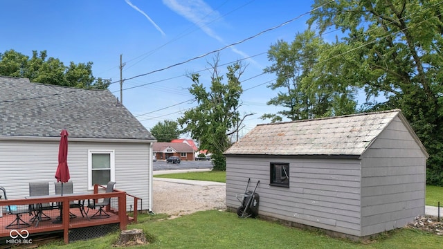 43 W Main St, North Vernon, IN 47265 - view of green lawn featuring outdoor dining area, a deck, and a storage shed