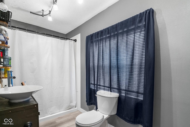 43 W Main St, North Vernon, IN 47265 - bathroom featuring wood finished floors, a shower with curtain, and vanity
