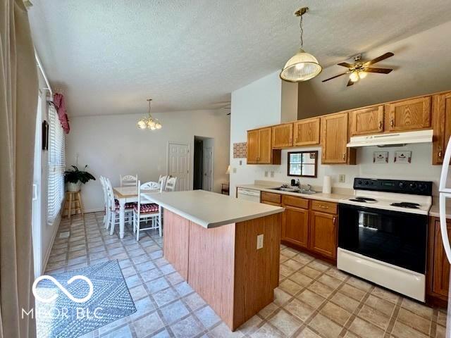 1042 W Oak Hill Xing, Crawfordsville, IN 47933 - kitchen with electric range, under cabinet range hood, light countertops, a chandelier, and a center island