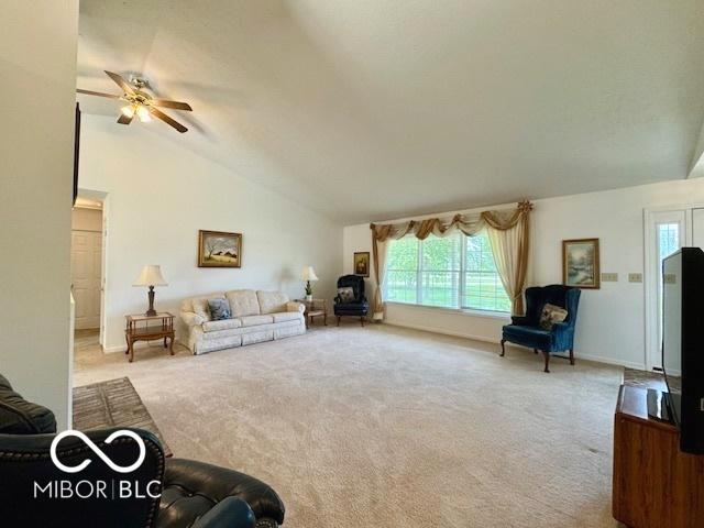 1042 W Oak Hill Xing, Crawfordsville, IN 47933 - carpeted living area featuring ceiling fan and vaulted ceiling