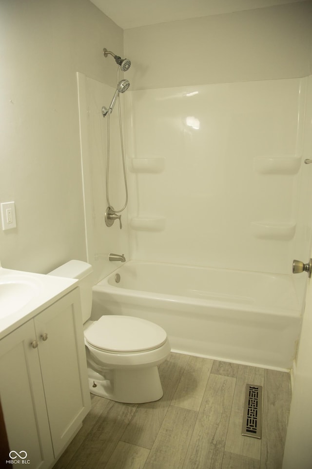 12 E N St, New Palestine, IN 46163 - bathroom with wood finished floors, vanity, and  shower combination