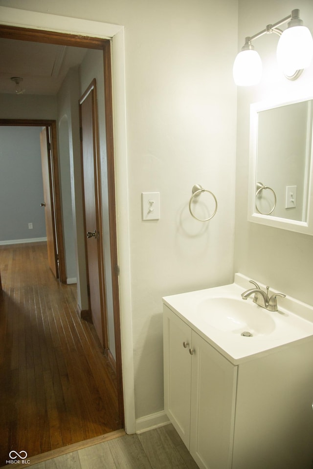 12 E N St, New Palestine, IN 46163 - bathroom featuring wood finished floors and vanity
