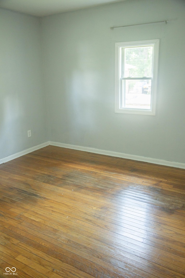 12 E N St, New Palestine, IN 46163 - empty room with hardwood / wood-style floors
