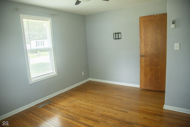 12 E N St, New Palestine, IN 46163 - unfurnished room featuring hardwood / wood-style floors and a ceiling fan