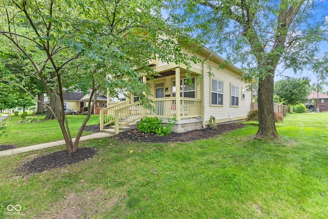 2232 N Park Ave, Indianapolis, IN 46205 - view of home's exterior featuring covered porch and a yard