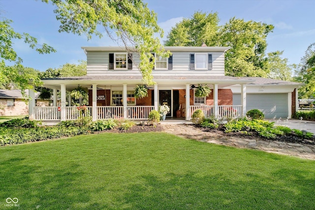 1244 Darby Ln, Indianapolis, IN 46260 - farmhouse with a porch, brick siding, a front lawn, and a garage