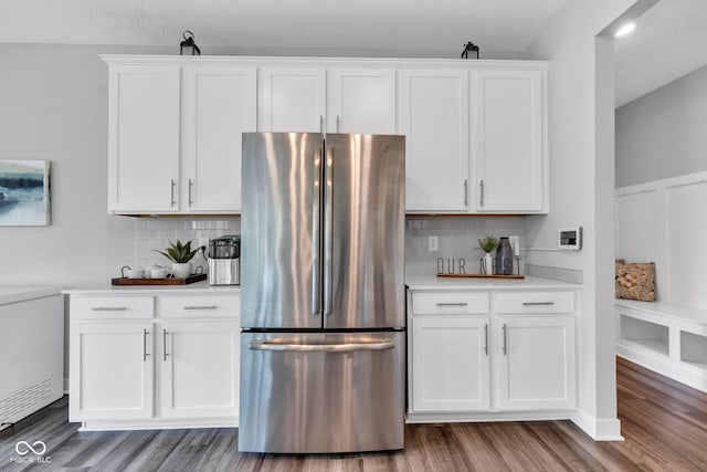 9978 Trafford Ct, Mccordsville, IN 46055 - kitchen with freestanding refrigerator, wood finished floors, and white cabinetry