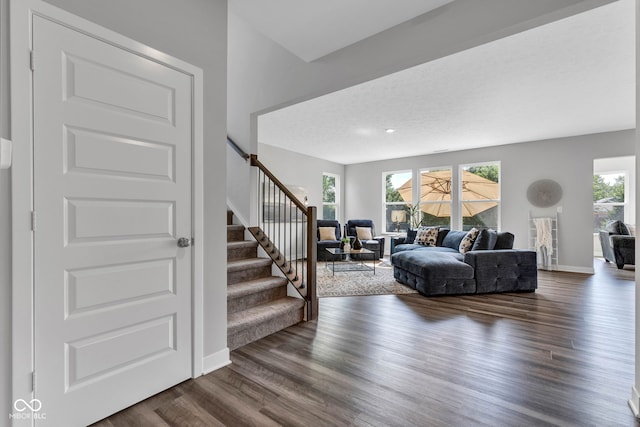 9978 Trafford Ct, Mccordsville, IN 46055 - living area featuring stairway and dark wood-style flooring