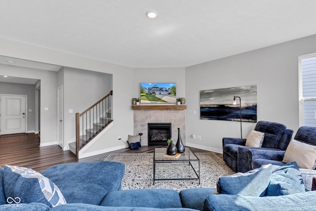 9978 Trafford Ct, Mccordsville, IN 46055 - living room featuring wood finished floors, a tile fireplace, stairs, and recessed lighting